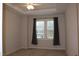 Bedroom features neutral walls, plush carpet and a ceiling fan at 141 Rolesville Ridge Drive Dr, Rolesville, NC 27571