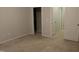 Bedroom featuring neutral carpet and walls, as well as a view into hallway and closet at 141 Rolesville Ridge Drive Dr, Rolesville, NC 27571