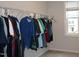 Walk-in closet featuring wire shelving racks and rods for storage with window view at 141 Rolesville Ridge Drive Dr, Rolesville, NC 27571