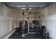 This garage is set up as an exercise area with rubber flooring and multiple pieces of workout equipment at 141 Rolesville Ridge Drive Dr, Rolesville, NC 27571
