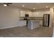 Open kitchen with white cabinets, stainless appliances, granite countertops, and island at 141 Rolesville Ridge Drive Dr, Rolesville, NC 27571