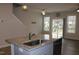 Kitchen island with sink and granite countertop at 141 Rolesville Ridge Drive Dr, Rolesville, NC 27571