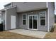 View of the outdoor patio with sliding glass doors that offer easy access to indoor living spaces at 141 Rolesville Ridge Drive Dr, Rolesville, NC 27571