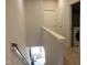 Second floor hallway overlooking downstairs with laundry room at 141 Rolesville Ridge Drive Dr, Rolesville, NC 27571