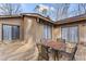 Cozy backyard deck with wooden table and chairs, ideal for outdoor dining at 145 Traceway N, Sanford, NC 27332