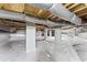 The renovated basement showcases plastic encapsulated walls and metallic insulation at 145 Traceway N, Sanford, NC 27332