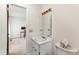 Small bathroom featuring a vanity, toilet, and an adjacent room at 145 Traceway N, Sanford, NC 27332