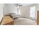 Bright bedroom with a ceiling fan, natural light and carpeted flooring at 145 Traceway N, Sanford, NC 27332