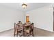 Cozy dining area with a wood table and upholstered chairs under a flush mount light fixture at 145 Traceway N, Sanford, NC 27332