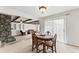 Open-concept dining area with a wood table and sliding glass doors for lots of natural light at 145 Traceway N, Sanford, NC 27332