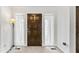 Inviting entryway with a solid wood door and sidelight windows at 145 Traceway N, Sanford, NC 27332