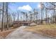 Charming single-story brick home featuring a long driveway and carport at 145 Traceway N, Sanford, NC 27332