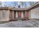 Close-up of the home's front entrance with a brick facade and a welcoming red door at 145 Traceway N, Sanford, NC 27332