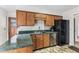 Well-equipped kitchen with wood cabinets, a convenient breakfast bar, and modern appliances at 145 Traceway N, Sanford, NC 27332