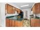 Functional kitchen featuring wood cabinetry, a breakfast bar, and a double basin sink at 145 Traceway N, Sanford, NC 27332