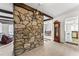 Charming living room featuring a stone accent wall and an open floor plan at 145 Traceway N, Sanford, NC 27332