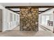 Beautifully designed living room with a stone accent wall and bright light at 145 Traceway N, Sanford, NC 27332