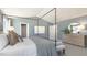 Bright main bedroom with neutral carpeting and ample closet space at 150 Ethel Ln, Angier, NC 27501