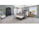 Spacious main bedroom featuring neutral carpeting, and a decorative canopy bed frame at 150 Ethel Ln, Angier, NC 27501
