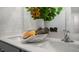 Bright bathroom featuring double sinks, decor, and modern fixtures against a neutral, patterned wall at 164 Ethel Ln, Angier, NC 27501