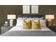 Comfortable bedroom showcasing a bed with decorative pillows and stylish nightstands with lamps at 164 Ethel Ln, Angier, NC 27501