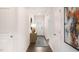 Modern hallway with wood flooring, neutral walls, and contemporary decor at 164 Ethel Ln, Angier, NC 27501