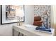 Stylish home office with a minimalist desk setup, artistic decor, and a comfortable chair for productive work at 164 Ethel Ln, Angier, NC 27501