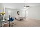 Spacious bedroom featuring a ceiling fan, desk, and natural light from many windows at 193 Long Meadow Ln, Fuquay Varina, NC 27526