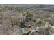 Aerial view of a home nestled among the trees, offering a serene and private setting at 2004 Beecham Cir, Raleigh, NC 27607