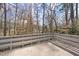 This concrete railed balcony has forest views at 2004 Beecham Cir, Raleigh, NC 27607