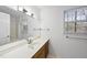 Bathroom featuring a large mirror and a window that provides natural lighting at 2004 Beecham Cir, Raleigh, NC 27607