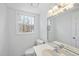 Bathroom with a white vanity, toilet, and natural light at 2004 Beecham Cir, Raleigh, NC 27607