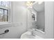 Bright bathroom with a large mirror and a stylish sink, capturing a clean and modern aesthetic at 2004 Beecham Cir, Raleigh, NC 27607
