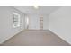 Bright and open bedroom with multiple windows and an ensuite bathroom at 2004 Beecham Cir, Raleigh, NC 27607
