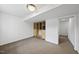 Spacious room with neutral carpet and built-in shelving offering versatile storage solutions for organized living at 2004 Beecham Cir, Raleigh, NC 27607