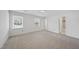Bright and open bedroom with multiple windows and an ensuite bathroom at 2004 Beecham Cir, Raleigh, NC 27607