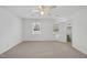 Spacious bedroom with ceiling fan, neutral carpeting, and large closet at 2004 Beecham Cir, Raleigh, NC 27607