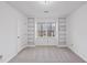 Bright bedroom featuring built-in bookshelves, neutral carpeting, and natural light from the window at 2004 Beecham Cir, Raleigh, NC 27607