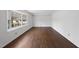 Bright bedroom featuring hardwood floors and a large window at 2004 Beecham Cir, Raleigh, NC 27607