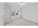 Bedroom with built-in shelving units and natural light at 2004 Beecham Cir, Raleigh, NC 27607