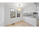 Dining area adjacent to kitchen with natural light at 2004 Beecham Cir, Raleigh, NC 27607