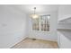 Cozy dining area with natural light and modern lighting fixture at 2004 Beecham Cir, Raleigh, NC 27607
