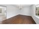 Bright dining room with a large window and chandelier at 2004 Beecham Cir, Raleigh, NC 27607