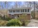 Beautifully landscaped two-story home with a garden and paved driveway at 2004 Beecham Cir, Raleigh, NC 27607