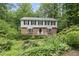 Charming two-story brick and siding home with lush, mature landscaping and a welcoming entrance at 2004 Beecham Cir, Raleigh, NC 27607