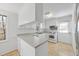Bright kitchen featuring white cabinets and countertops, and stainless steel appliances at 2004 Beecham Cir, Raleigh, NC 27607