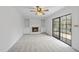 Spacious living room with fireplace, built-ins, and a sliding door at 2004 Beecham Cir, Raleigh, NC 27607