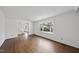 Sunlit living room boasting hardwood floors and large windows at 2004 Beecham Cir, Raleigh, NC 27607