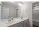 Bright bathroom featuring double sinks, a large mirror, and ample counter space at 201 Northview Dr, Middlesex, NC 27557