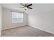 Clean bedroom with neutral carpet, a ceiling fan, and a bright window at 201 Northview Dr, Middlesex, NC 27557